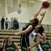 Father Gabriel Richard junior Emily Hogan and Skyline senior Troi Owens compete for a ball on Friday. Daniel Brenner I AnnArbor.com